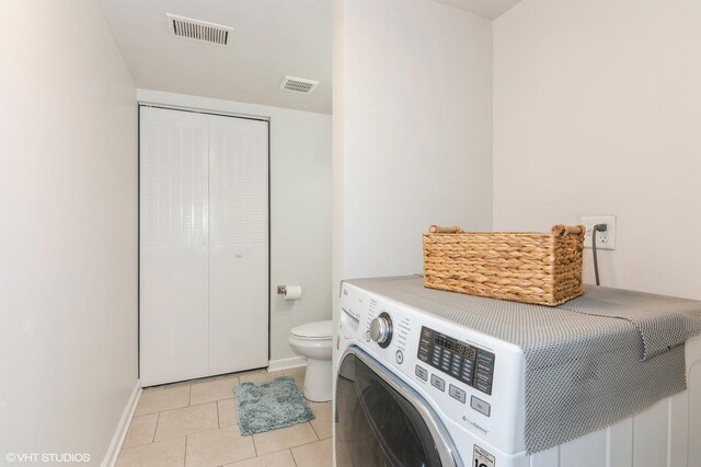 505 Redondo Dr Unit 311, Downers Grove, IL 60516 - laundry room featuring washer / dryer, baseboards, laundry area, and visible vents