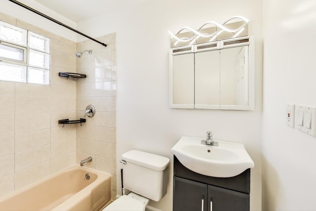 bathroom with vanity, toilet, and shower / bathtub combination