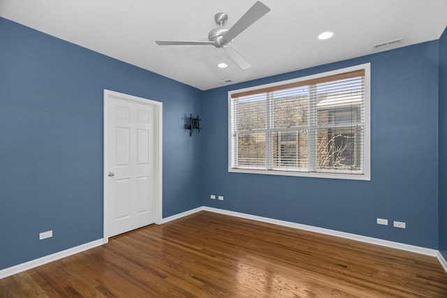 spare room featuring visible vents, ceiling fan, baseboards, recessed lighting, and wood finished floors