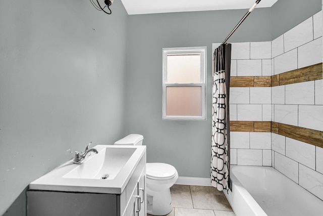 bathroom with vanity, baseboards, shower / bath combo, tile patterned floors, and toilet