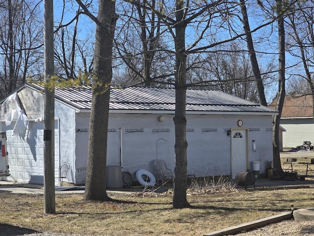 view of property exterior featuring stucco siding and metal roof