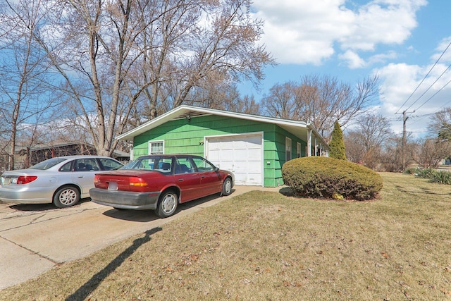 view of side of property with a yard and driveway