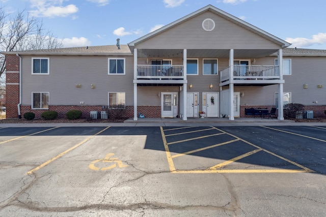 view of property featuring uncovered parking