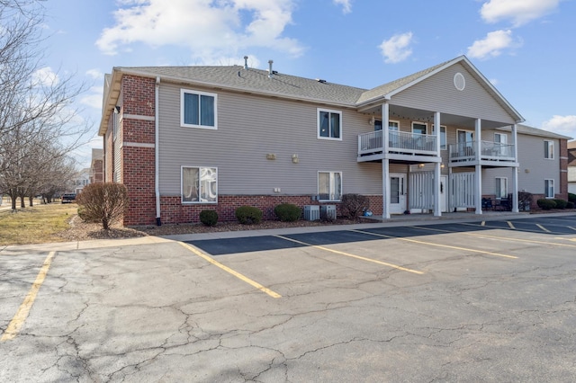 view of property with uncovered parking