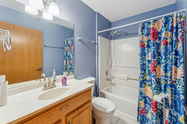 bathroom featuring toilet, vanity, and shower / bath combo