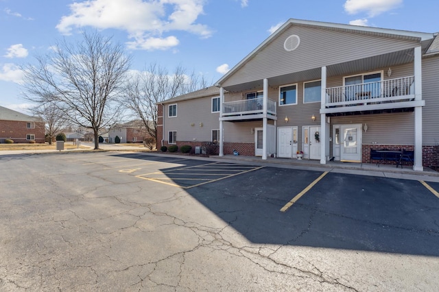 view of property with uncovered parking