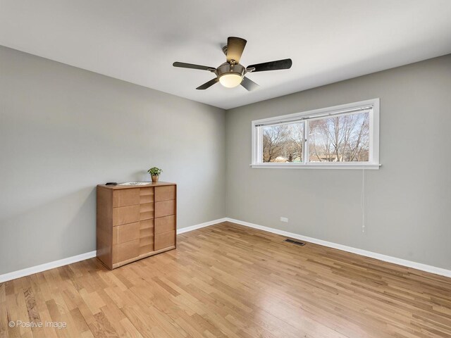 unfurnished bedroom with baseboards, visible vents, light wood finished floors, and ceiling fan