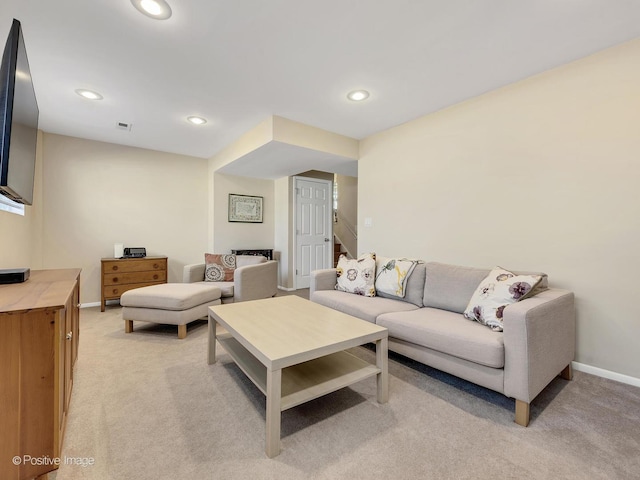 living room with stairway, recessed lighting, baseboards, and light carpet