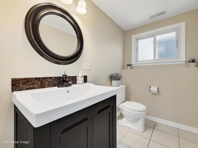 bathroom with tile patterned flooring, visible vents, backsplash, toilet, and vanity