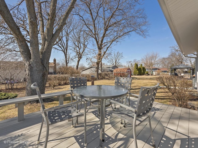 deck with outdoor dining space