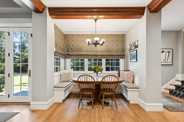 2855 Sheridan Pl, Evanston, IL 60201 - dining room with light wood-style flooring, healthy amount of natural light, a chandelier, and stairway