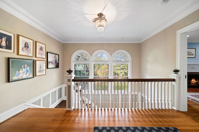 2855 Sheridan Pl, Evanston, IL 60201 - hallway featuring ornamental molding, wood finished floors, an upstairs landing, and a chandelier