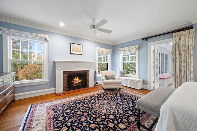 2855 Sheridan Pl, Evanston, IL 60201 - bedroom featuring wood finished floors, crown molding, a brick fireplace, radiator, and recessed lighting