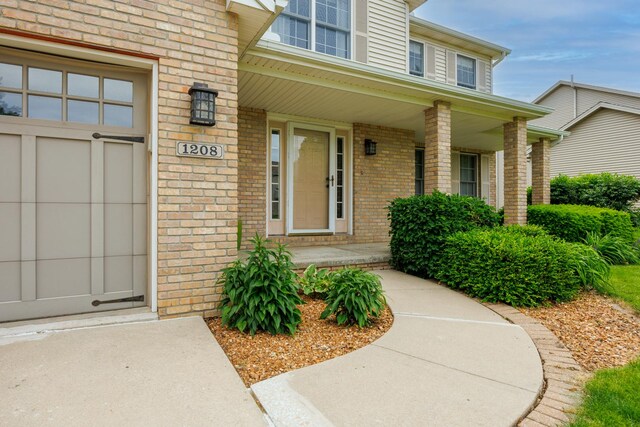 1208 Broad Creek Rd, Bloomington, IL 61704 - entrance to property featuring brick siding and covered porch
