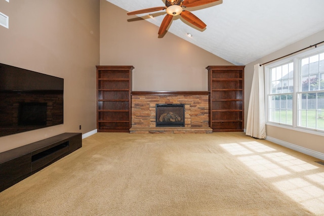 1208 Broad Creek Rd, Bloomington, IL 61704 - unfurnished living room with a stone fireplace, carpet, baseboards, plenty of natural light, and high vaulted ceiling