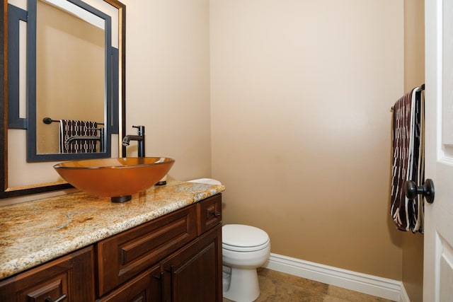 1208 Broad Creek Rd, Bloomington, IL 61704 - bathroom with vanity, toilet, and baseboards