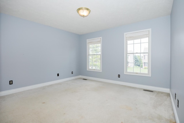 1208 Broad Creek Rd, Bloomington, IL 61704 - empty room with light colored carpet and baseboards