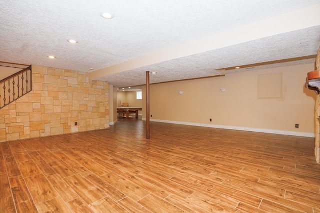 1208 Broad Creek Rd, Bloomington, IL 61704 - finished basement featuring a textured ceiling, light wood-type flooring, baseboards, and recessed lighting