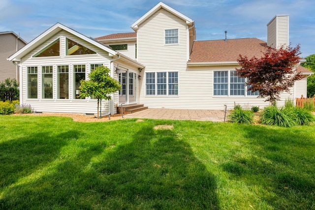 1208 Broad Creek Rd, Bloomington, IL 61704 - rear view of house with a lawn, a chimney, roof with shingles, and a patio