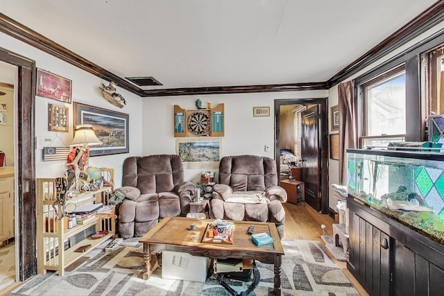 living room featuring light wood-style floors and ornamental molding