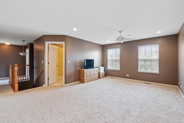 2668 Bull Run Dr, Aurora, IL 60503 - unfurnished living room featuring carpet flooring, visible vents, ceiling fan, baseboards, and recessed lighting