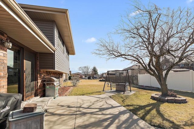 view of patio featuring grilling area and fence