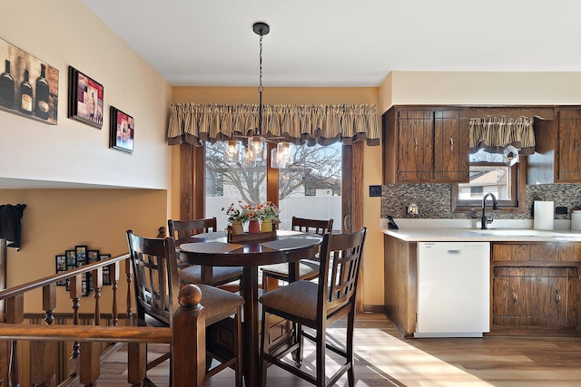 dining space with light wood-style floors