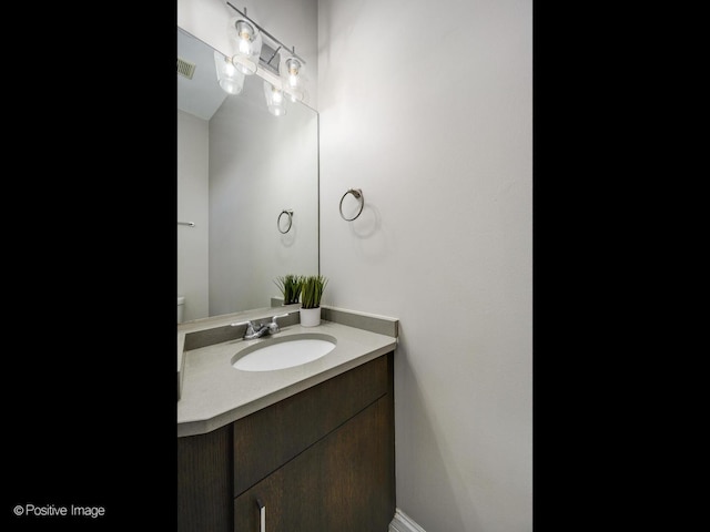 bathroom with vanity and visible vents