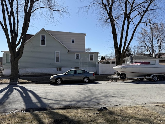 view of side of home with fence