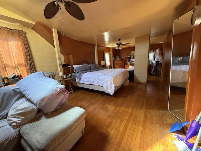 bedroom with hardwood / wood-style flooring and ceiling fan