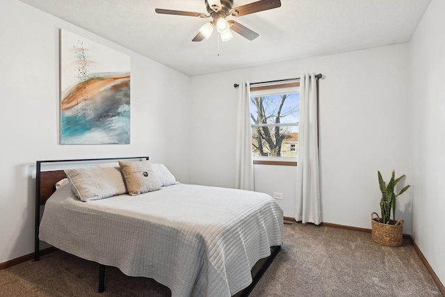 carpeted bedroom featuring ceiling fan and baseboards