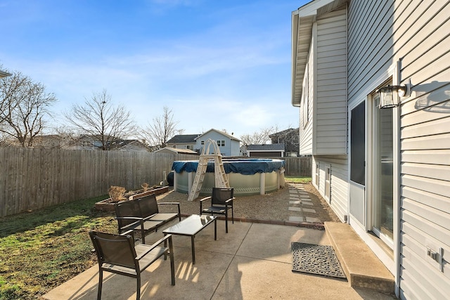 view of patio featuring a fenced backyard and a fenced in pool