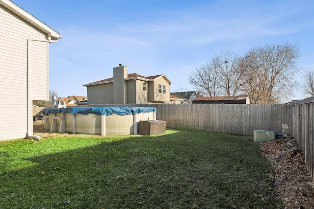 view of yard with a fenced in pool, cooling unit, and a fenced backyard