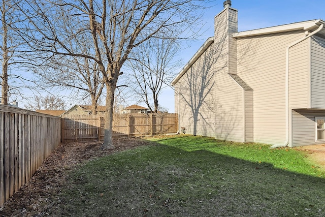 view of yard featuring a fenced backyard