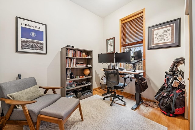 office featuring baseboards and wood finished floors