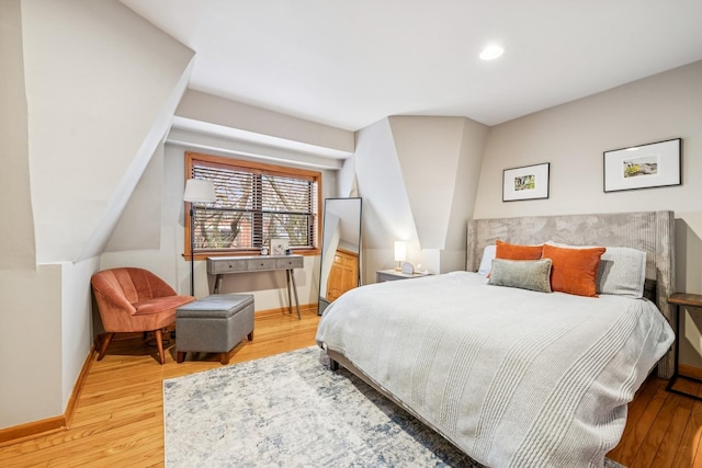 bedroom featuring light wood-type flooring and baseboards