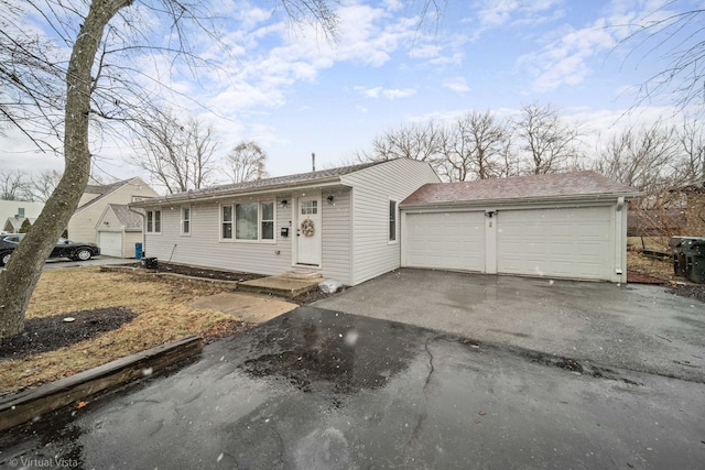 ranch-style house featuring a garage