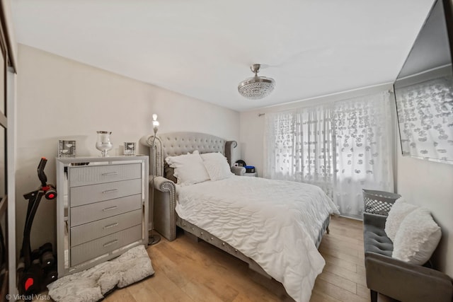 bedroom featuring light wood-style floors