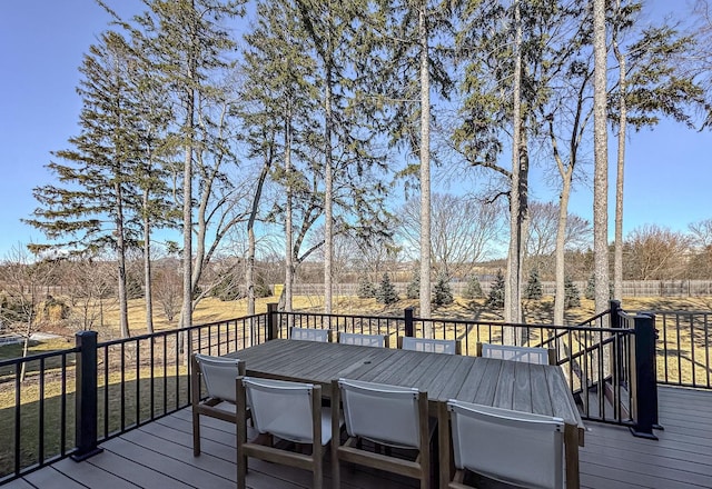 wooden deck featuring outdoor dining space