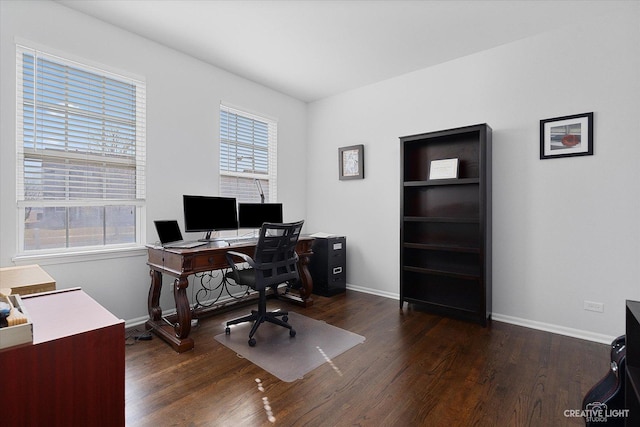 office area with baseboards and wood finished floors