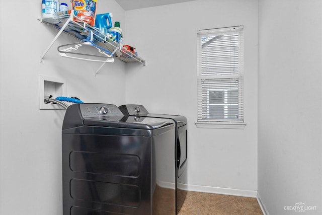 laundry room featuring baseboards, independent washer and dryer, and laundry area