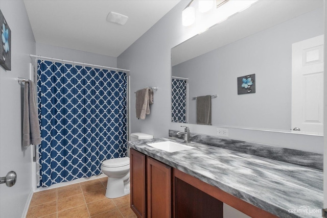 bathroom with vanity, tile patterned floors, toilet, and a shower with curtain