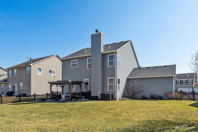 rear view of house featuring central AC unit, fence, a pergola, a chimney, and a lawn