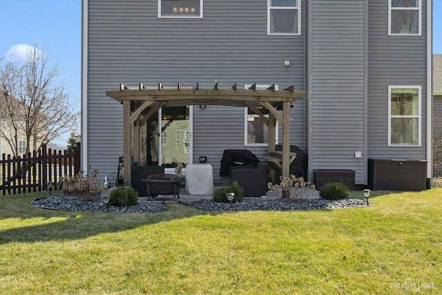 rear view of property with a yard, a patio, a pergola, and fence