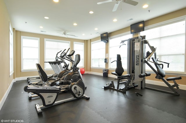 exercise room with recessed lighting, baseboards, plenty of natural light, and ceiling fan