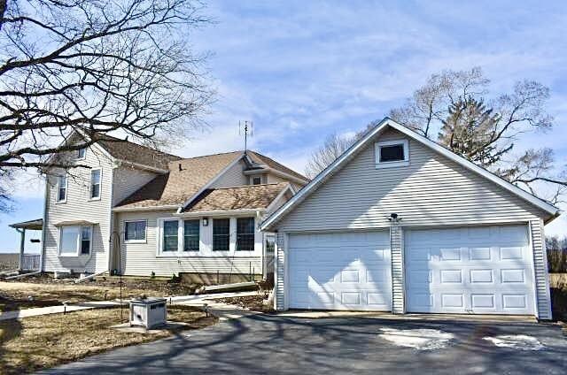 exterior space with driveway and a garage