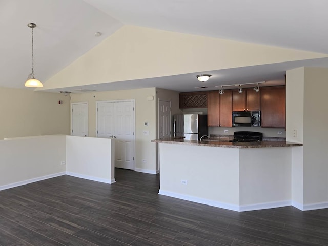 2401 Echelon Cir Unit C, Matteson, IL 60443 - kitchen with black microwave, range, freestanding refrigerator, track lighting, and dark stone countertops