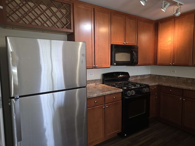 2401 Echelon Cir Unit C, Matteson, IL 60443 - kitchen featuring black appliances, dark wood-type flooring, and brown cabinetry