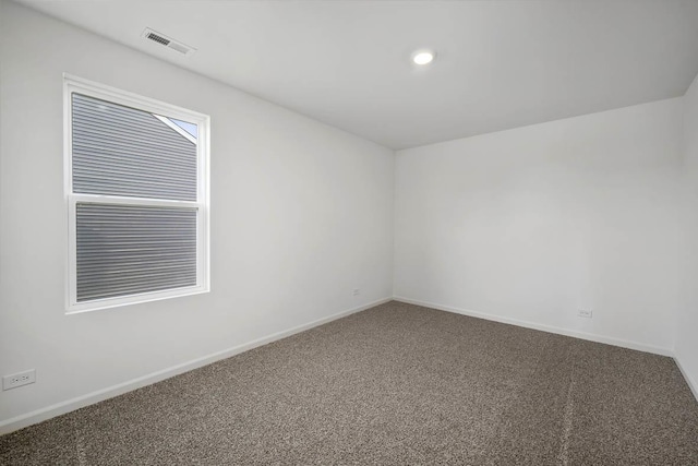 empty room featuring recessed lighting, baseboards, visible vents, and carpet floors