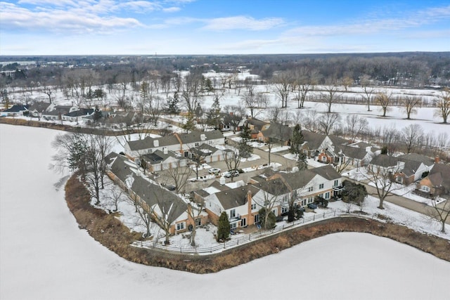 snowy aerial view featuring a residential view